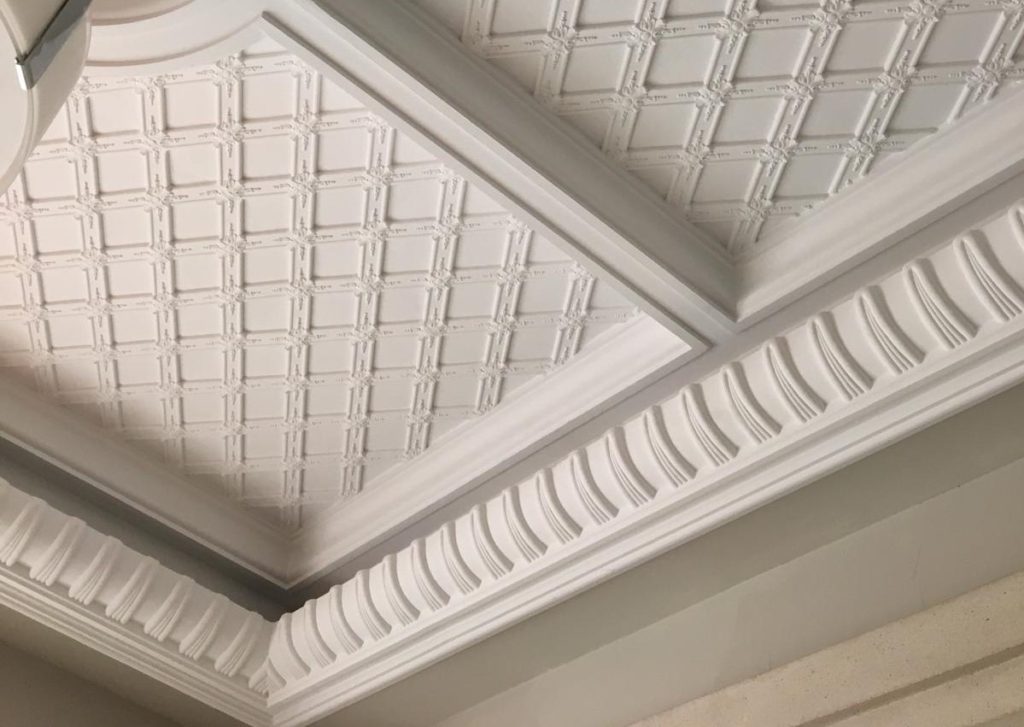 Interior spaces featuring elegant coffered ceiling