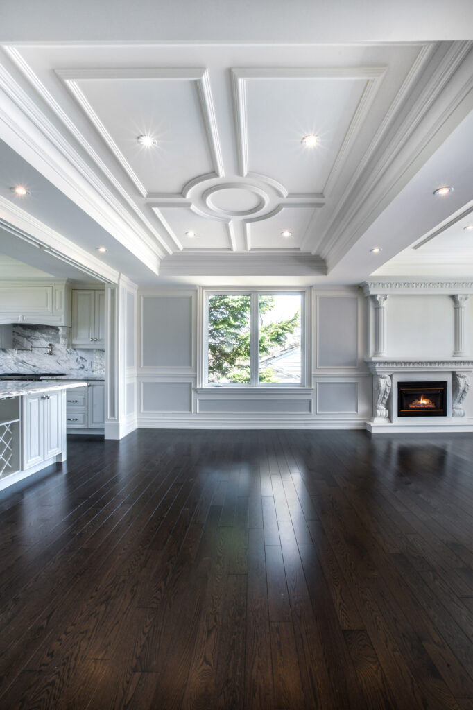 Interior spaces featuring elegant coffered ceilings in a living room