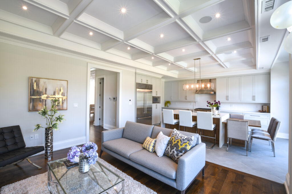 A collage of three interior spaces featuring elegant coffered ceilings in a living room