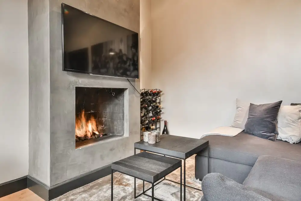 beautiful-living-room-with-concrete-fireplace-surround