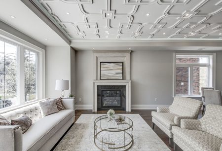 Interior spaces featuring elegant coffered ceilings in a living room