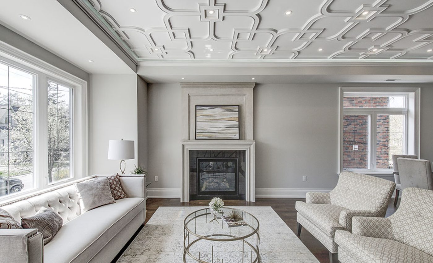 Interior spaces featuring elegant coffered ceilings in a living room