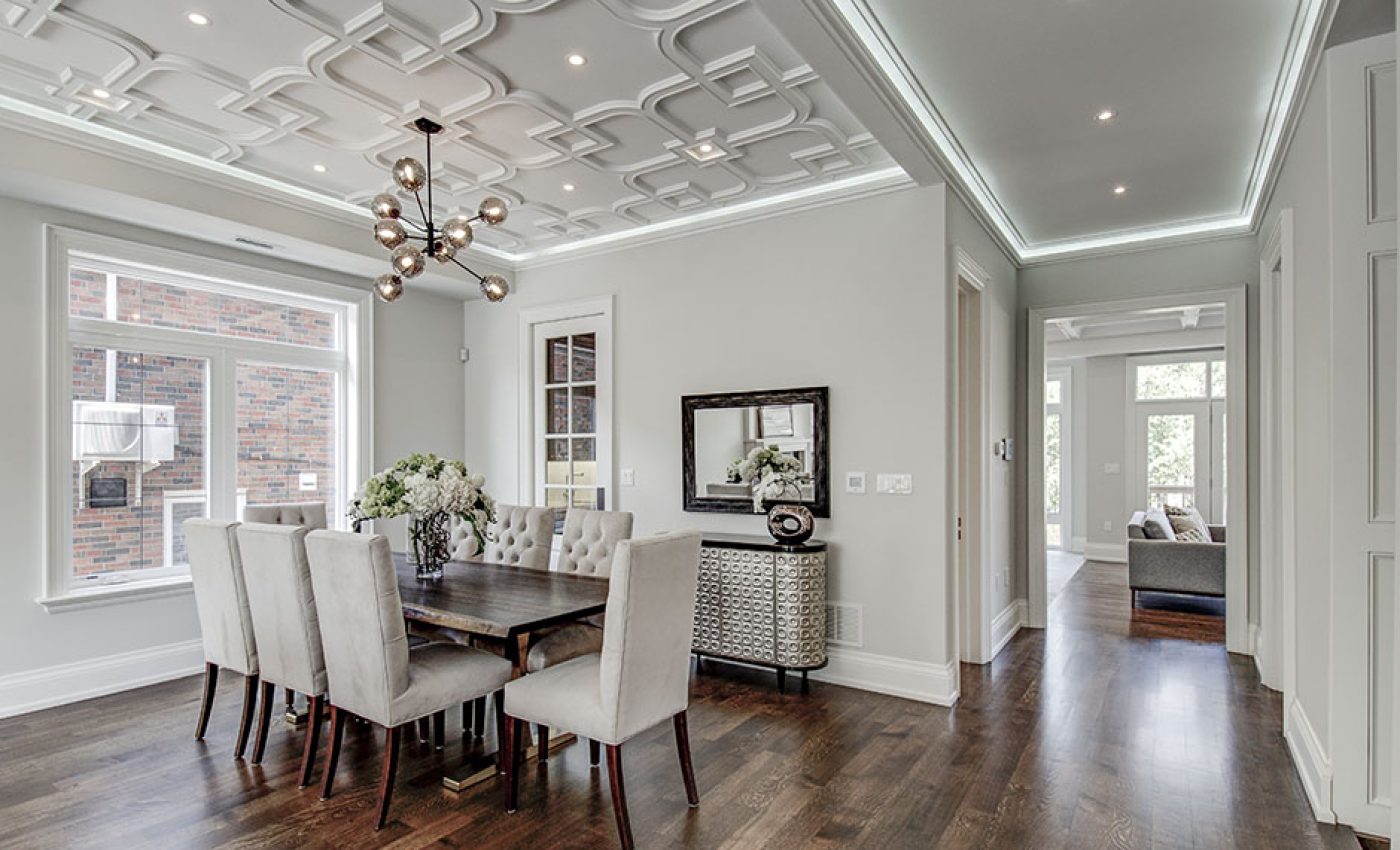 Interior spaces featuring elegant coffered ceilings in a dining room